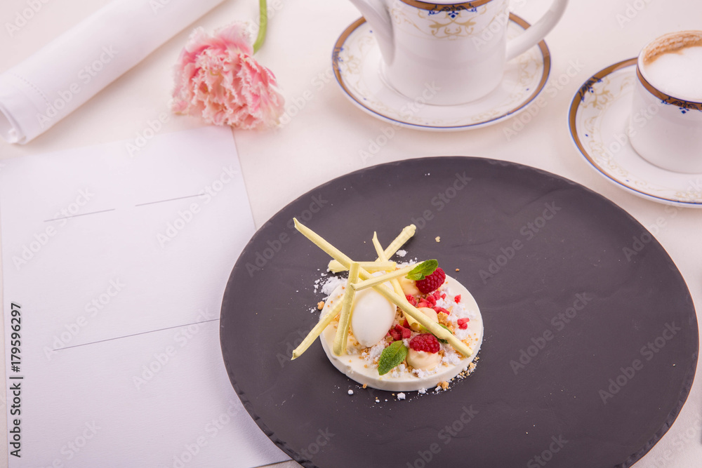 Lemon. Vanilla panna cotta with sorbet from a lemon, raspberry, caramelized sticks and fresh mint Lemon. Vanilla panna cotta with sorbet from a lemon, raspberry, caramelized sticks and fresh mint