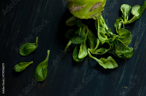 Fresh kohlrabi cabbage lies on the table. Healthy dinner in vegan and organic style. Farmer s lifestyle with local food.