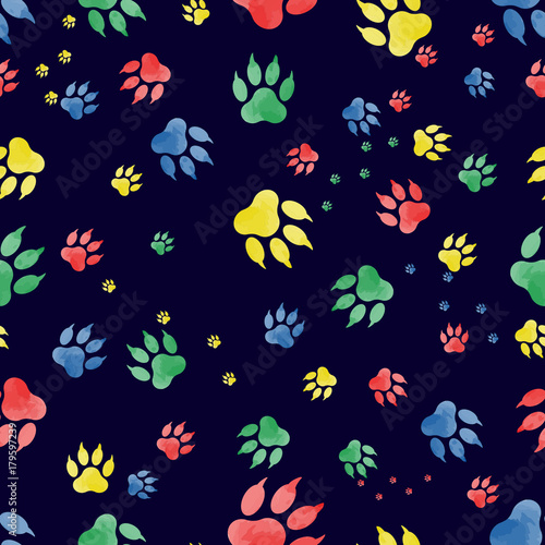 Seamless pattern of dog paw marks. Colorful traces of paws, made in watercolor, on a black background. Vektor