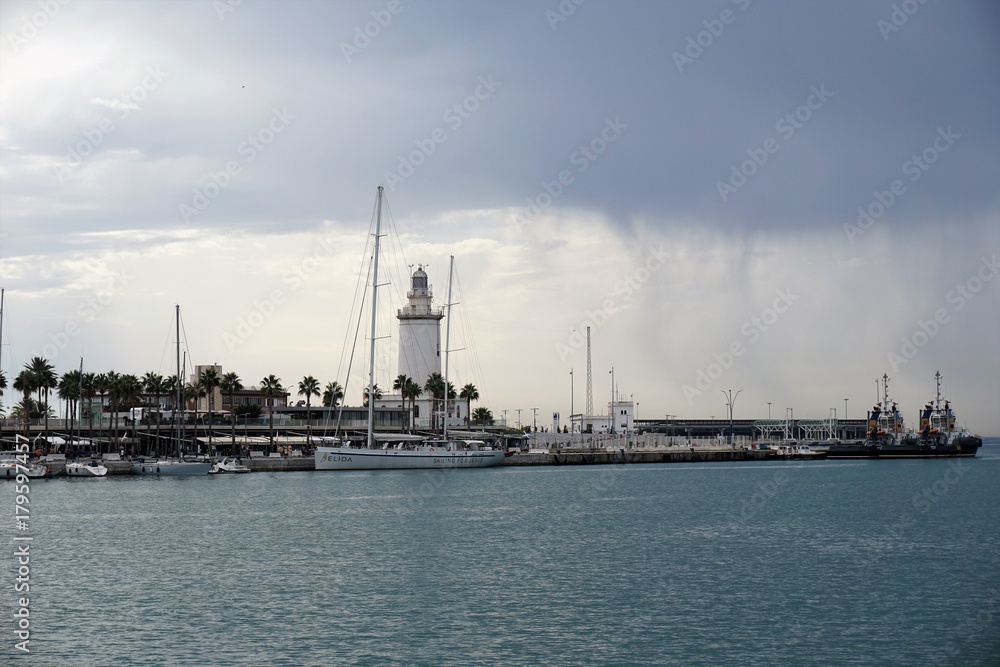 Fototapeta premium Lighthouse in rainy sky