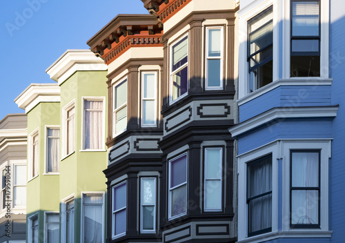 Row of colorful buildings with bay windows architecture in San Francisco, California