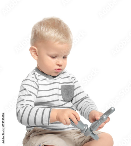 Cute little baby with toys,...