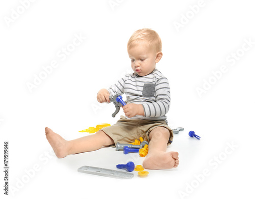 Cute little baby with toys,...