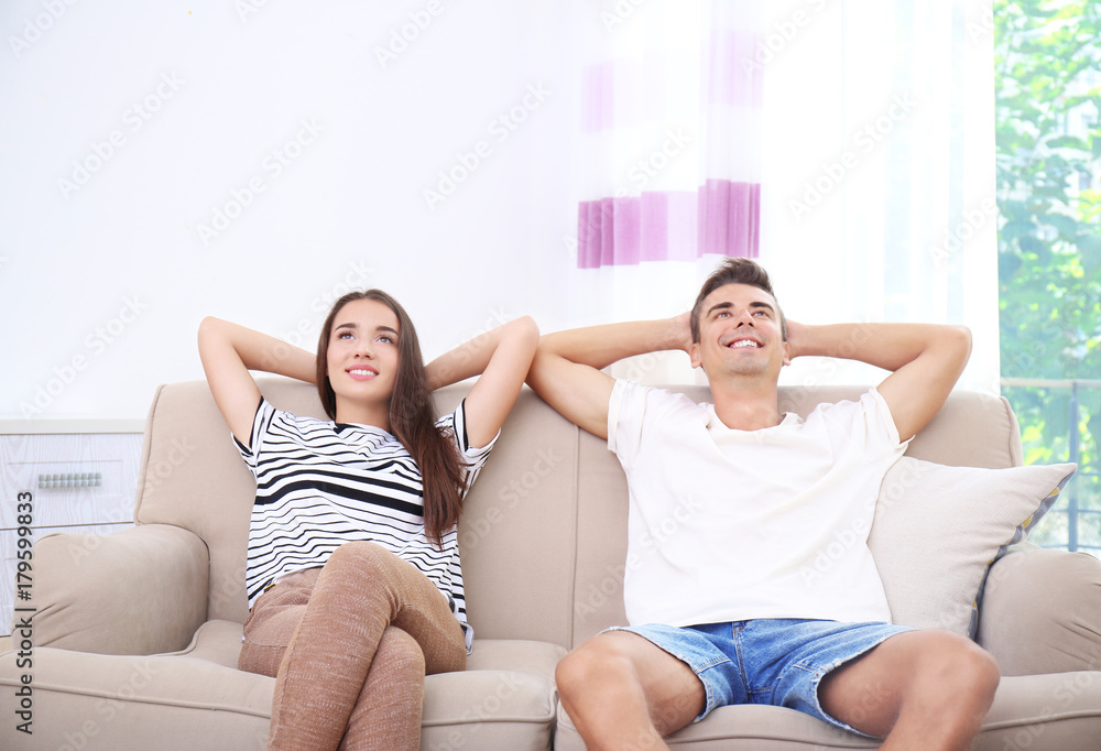Young couple on sofa at home Young couple on sofa at home