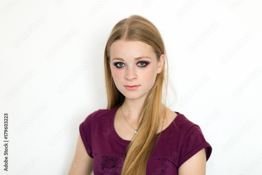 Model test portrait with young beautiful redhead freckles fashion model posing on white background with natural light. Model test portrait with young beautiful redhead freckles fashion model posing on white background with natural light.