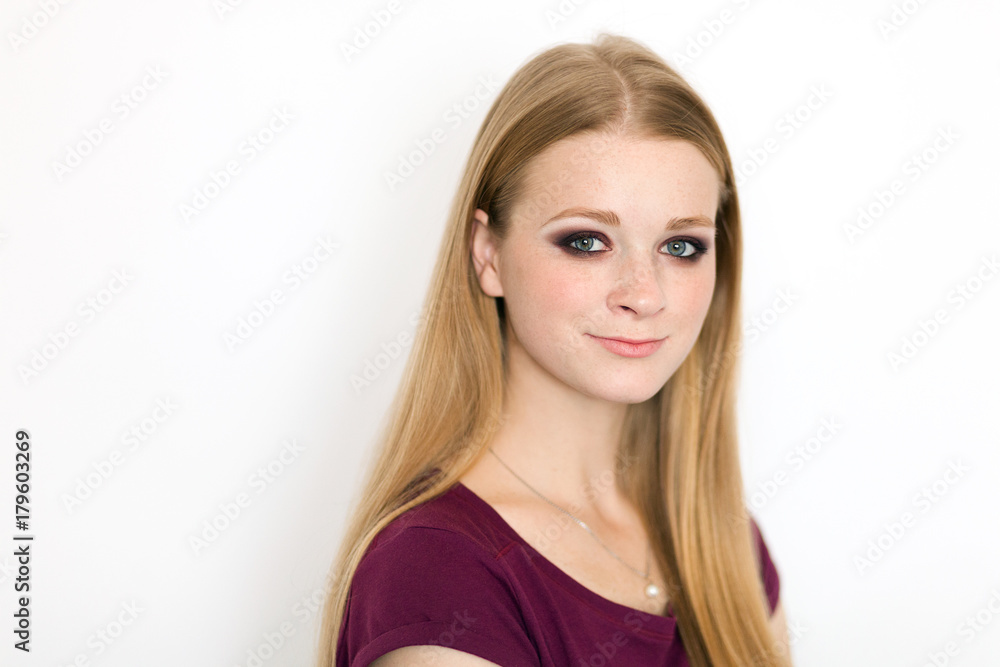 Model test portrait with young beautiful redhead freckles fashion model posing on white background with natural light. Model test portrait with young beautiful redhead freckles fashion model posing on white background with natural light.