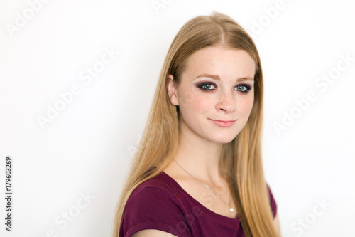 Wallpaper Mural Model test portrait with young beautiful redhead freckles fashion model posing on white background with natural light. Torontodigital.ca