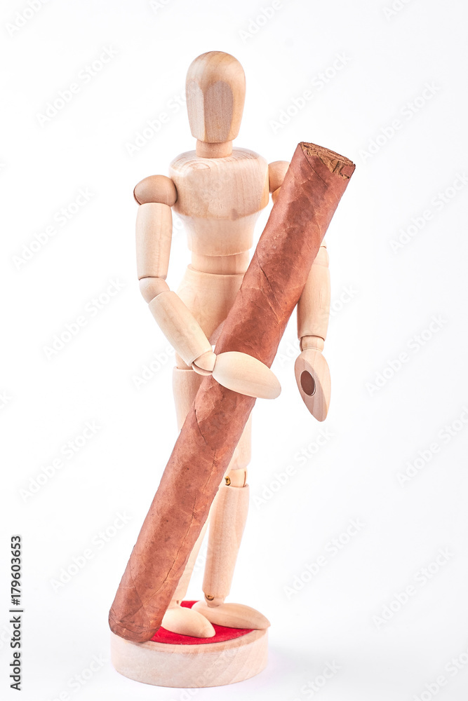Wooden dummy with cuban cigar. Human wooden mannequin with big brown cuban cigar, isolated on white background. Wooden dummy with cuban cigar. Human wooden mannequin with big brown cuban cigar, isolated on white background.