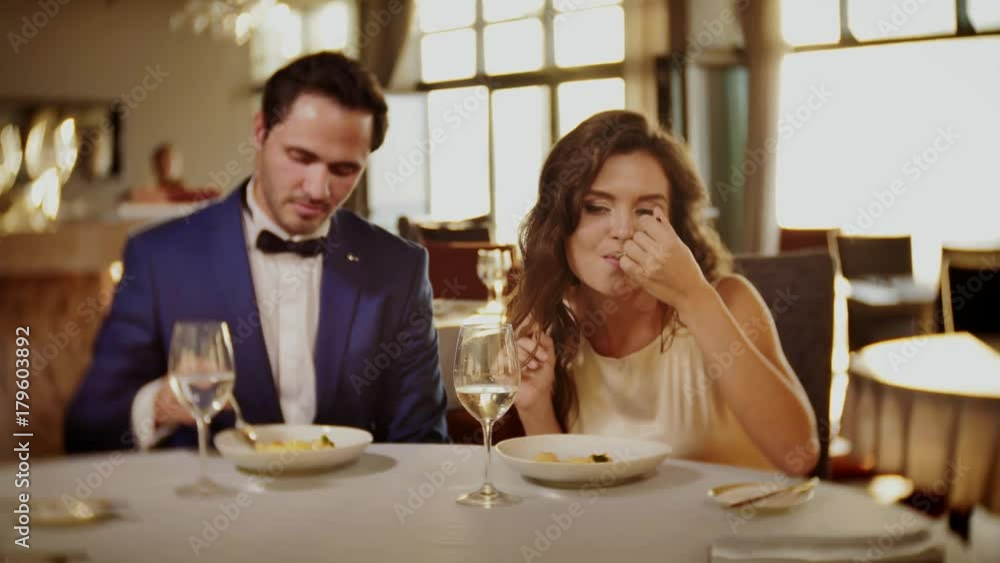 Beautiful couple eating dessert in a restaurant Beautiful couple eating dessert in a restaurant