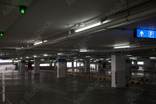 Empty parking garage in the shopping center. There is also a fire in the sign to give the user access to the parking.