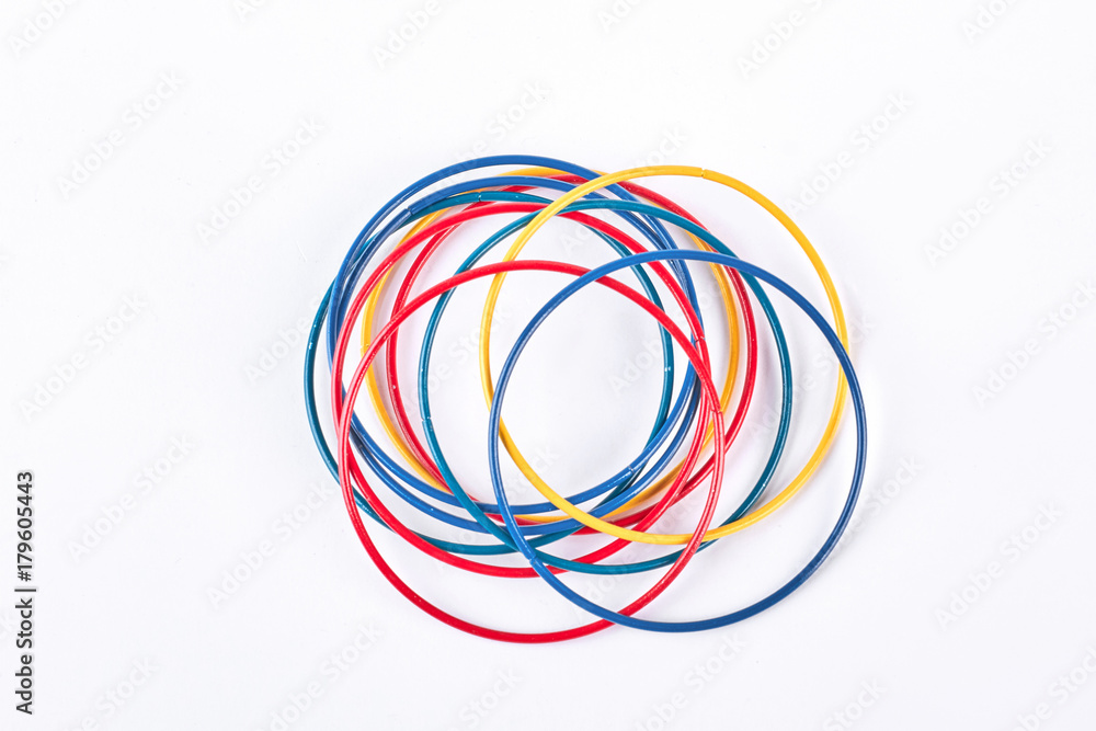 Set of colored bracelets, top view. Collection of plastic multicolored bangles on white background. Girls fashion accessories. Set of colored bracelets, top view. Collection of plastic multicolored bangles on white background. Girls fashion accessories.