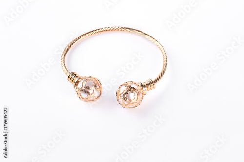 Gold bracelet on a white background. Female beautiful bracelet isolated on white background. Woman luxury jewelry.