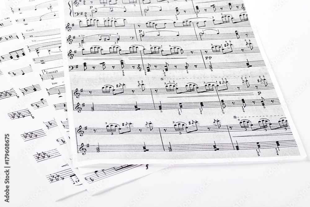 Sheets with musical notes. Pages with musical notes and keys, isolated on white background. Sheets with musical notes. Pages with musical notes and keys, isolated on white background.