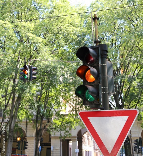 italian traffic light with two colors green and orange simultane photo