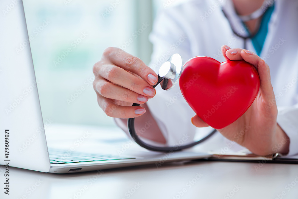 Doctor checking up heart in medical concept