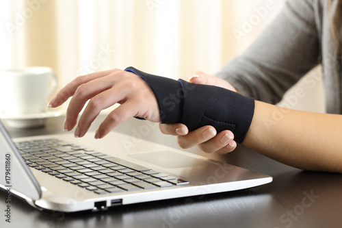 Woman hands with injured wrist complaining