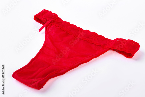 Female sexy lace pantie, white background. Sexy gift on Valentine day. Woman red undewear isolated on white background.