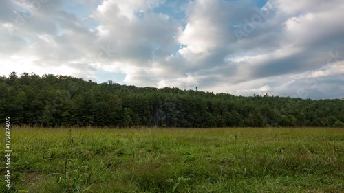 4K TL Clouds Blow Over Field in Cataloochee Valley photo