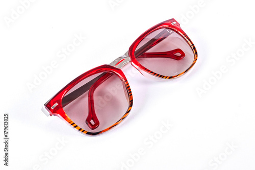 Red sunglasses isolated on white background. Sunglasses with red glass isolated on white background.
