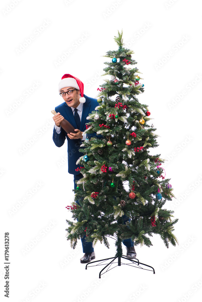 Businessman decorating christmas tree isolated on white Businessman decorating christmas tree isolated on white
