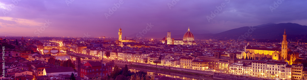 Panorama of famous Florence city and river Arno after sunset with night illumination, Tuscany, Italy, Europe. Travel outdoor sightseeing background.