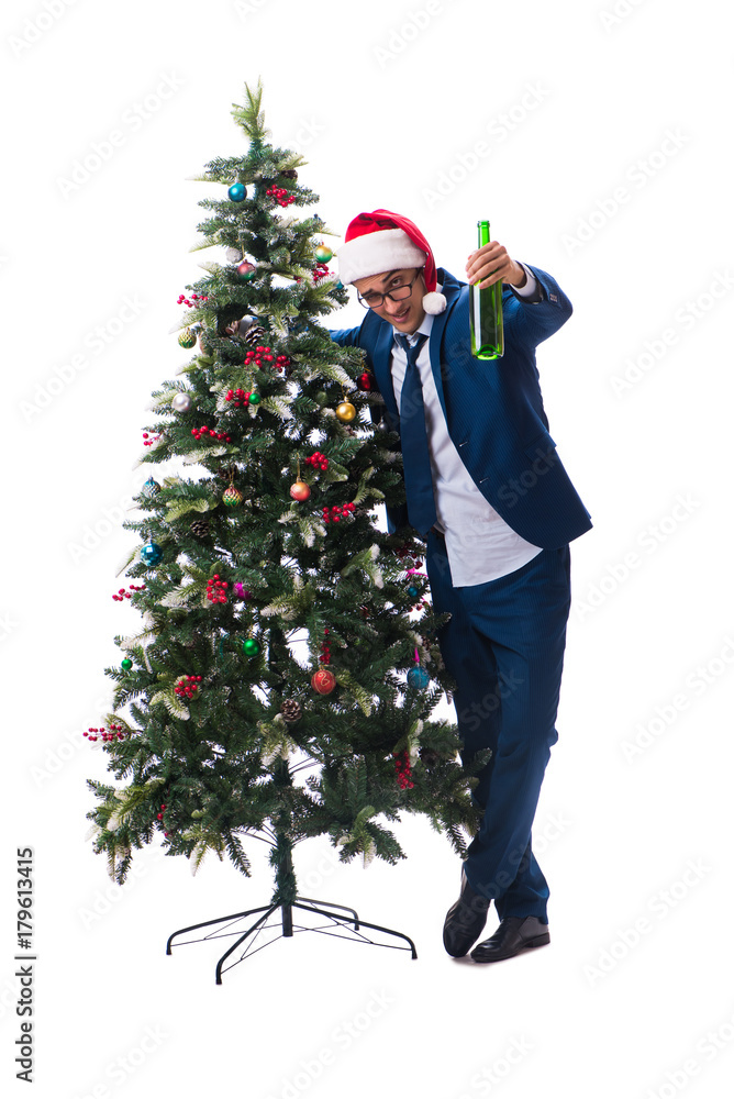 Businessman decorating christmas tree isolated on white Businessman decorating christmas tree isolated on white