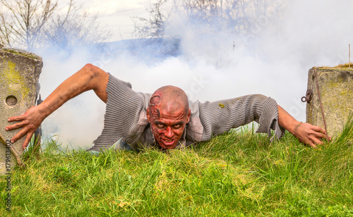 A living corpse climbing from the grave