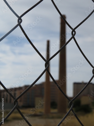a wire fence with a background