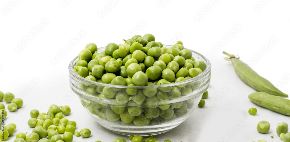 Raw Peas in Bowl, Isolated on White Background Raw Peas in Bowl, Isolated on White Background