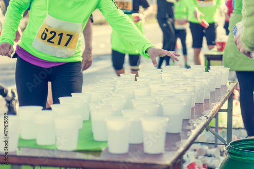 Runner taking a cup of water at H20 stand. photo