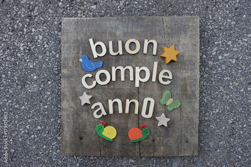 Buon Compleanno, Happy Birthday in italian language with wooden letters 