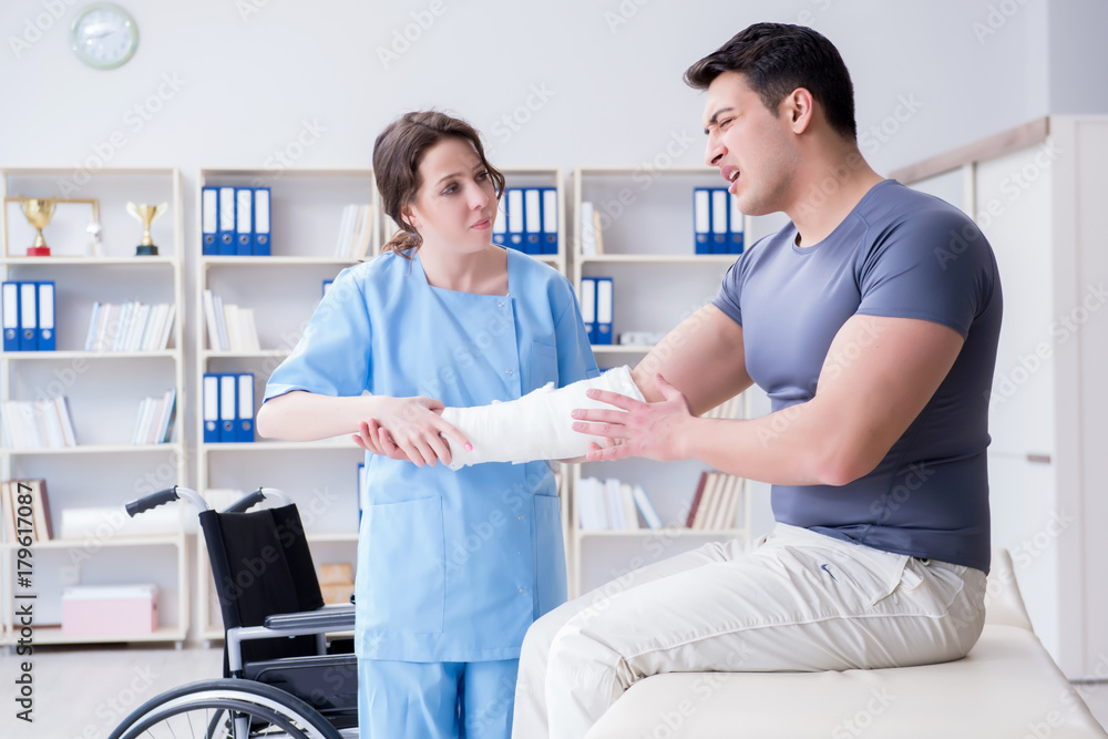 Fototapeta premium Doctor and patient during check-up for injury in hospital