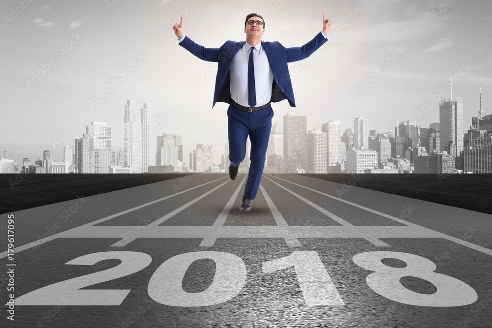 Businessman running towards new year 2018 Businessman running towards new year 2018