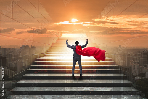 Businessman superhero successful in career ladder concept photo
