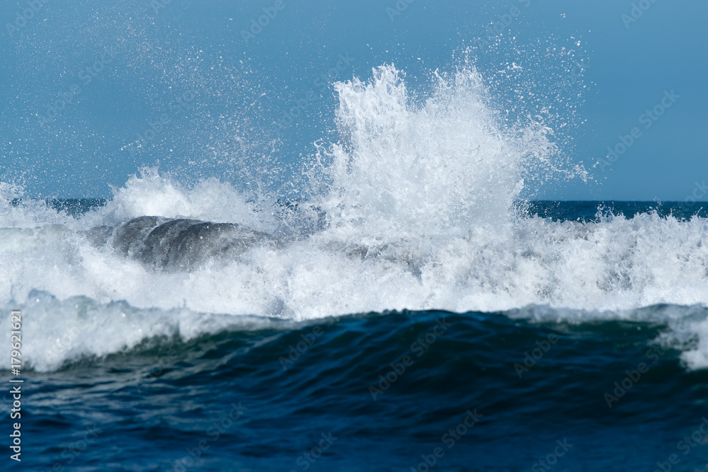 the ocean wave with a fountain of icy salt drops splits about the shore the ocean wave with a fountain of icy salt drops splits about the shore
