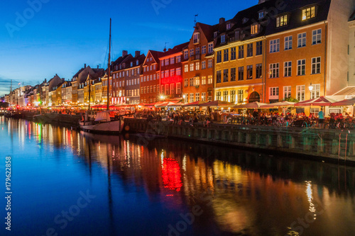 Evening panorama of Nyhavn district architecture in the Old Town of Copenhagen, Denmark