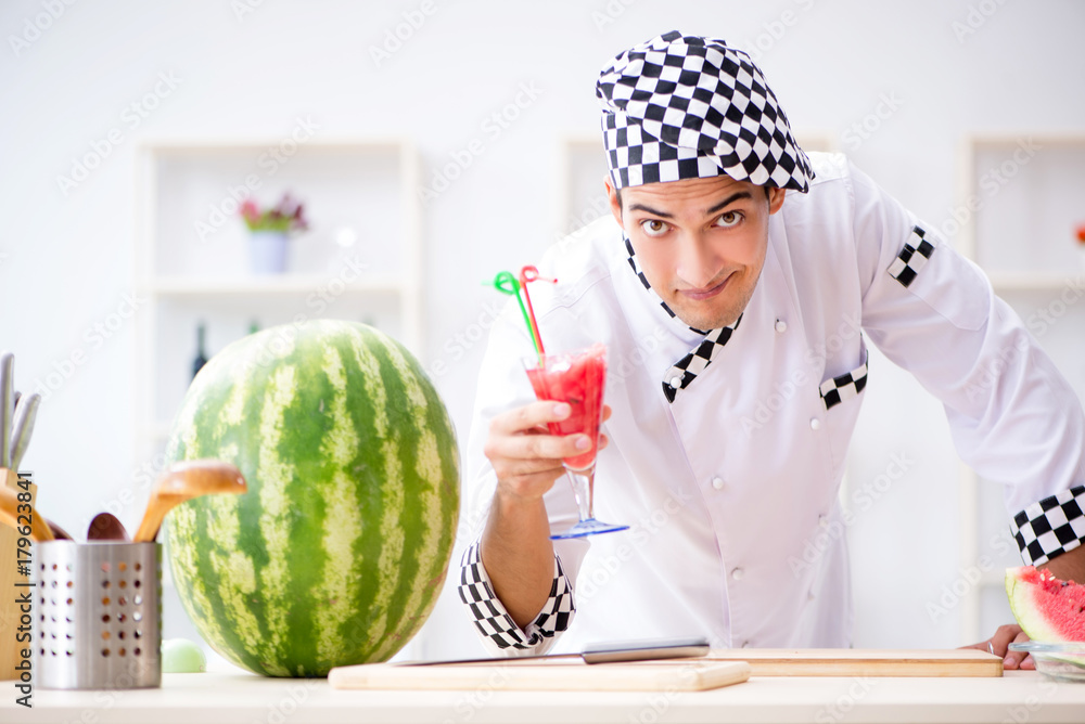 Fototapeta premium Male cook with watermelon in kitchen