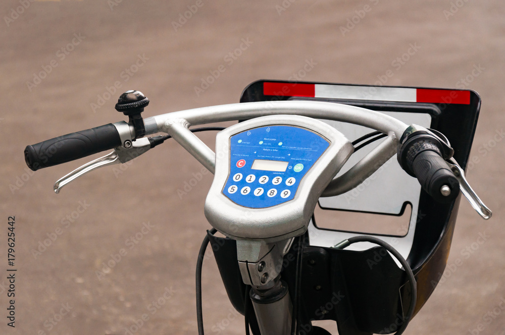 City bike rental system. Bicycle parts are large. Parking bicycles on city streets. With tinting and blurring. City bike rental system. Bicycle parts are large. Parking bicycles on city streets. With tinting and blurring.