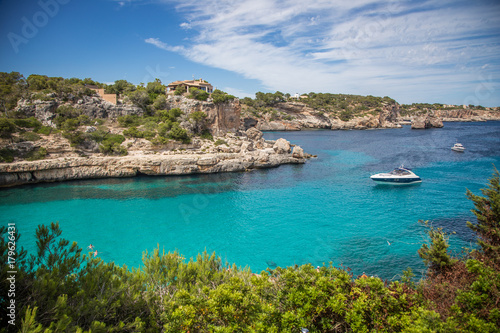 Blue Lagoon with a boat. Cala Llombards