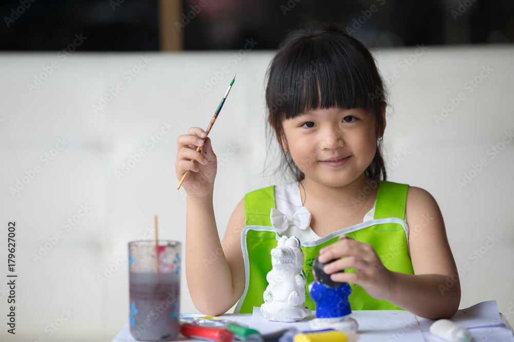 Asian girl painted on plaster doll Asian girl painted on plaster doll
