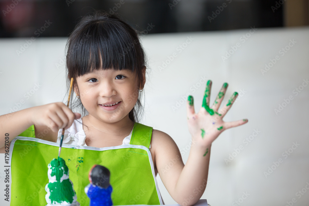 Asian girl painted on plaster doll Asian girl painted on plaster doll