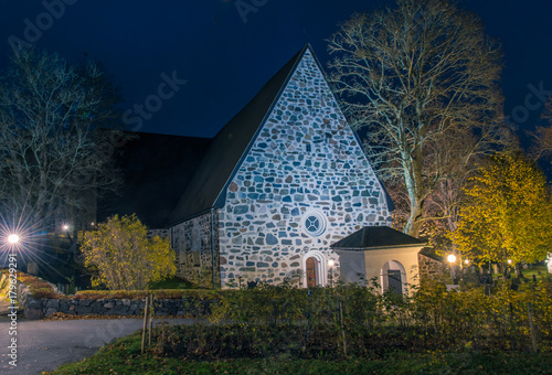 Värmdö kyrka på natten under Allhelgonahelgen photo