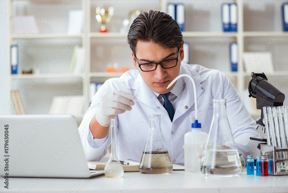 Young researcher scientist doing a water test contamination expe Young researcher scientist doing a water test contamination expe