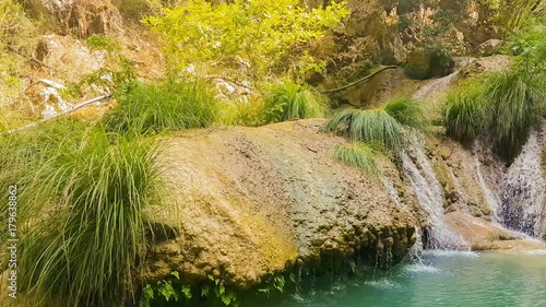 Beautiful pond with waterfall at Poilimnio in Greece. photo