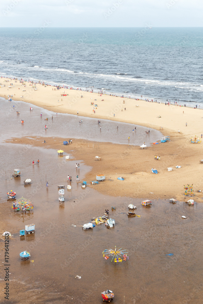 Birds eye view from light house. Temporary water pond formed in the marina beach due to heavy rainfall.ts longest natural urban beach in India and one of the world's longest beach ranking. Birds eye view from light house. Temporary water pond formed in the marina beach due to heavy rainfall.ts longest natural urban beach in India and one of the world's longest beach ranking.