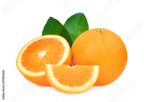 whole and half of orange fruit with green leaves isolated on white background