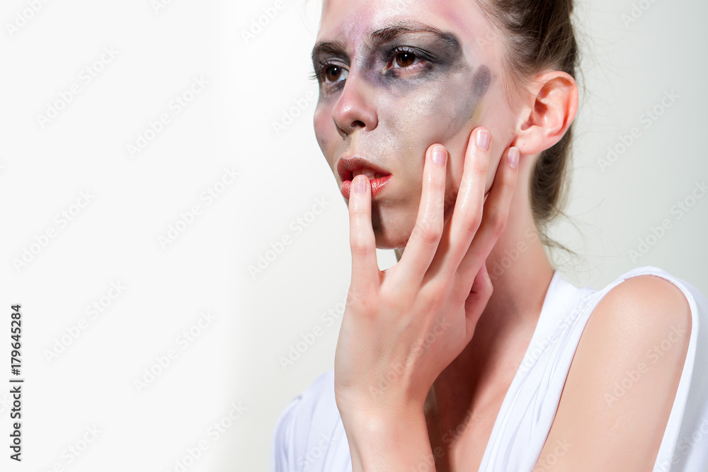 Woman with dirty face, art makeup isolated on white background Woman with dirty face, art makeup isolated on white background