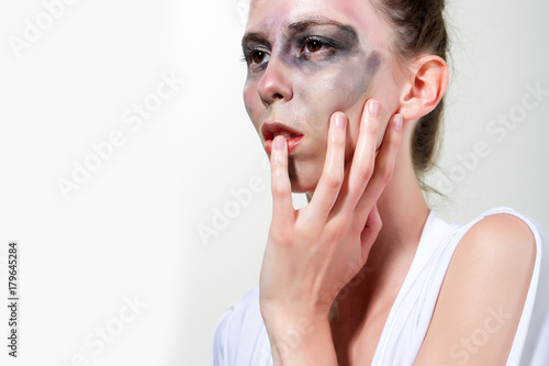 Woman with dirty face, art makeup isolated on white background