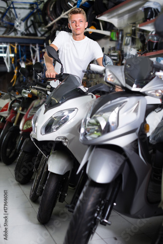Male is choosing new motorcycle