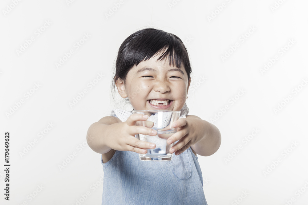 Pretty asian girl hand holding a cup of water with smile isolated white. Pretty asian girl hand holding a cup of water with smile isolated white.